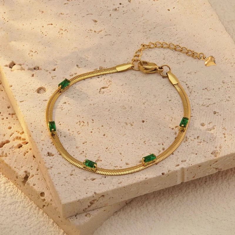 Elegant Gold Snake Chain Bracelet with Green Baguette Stones