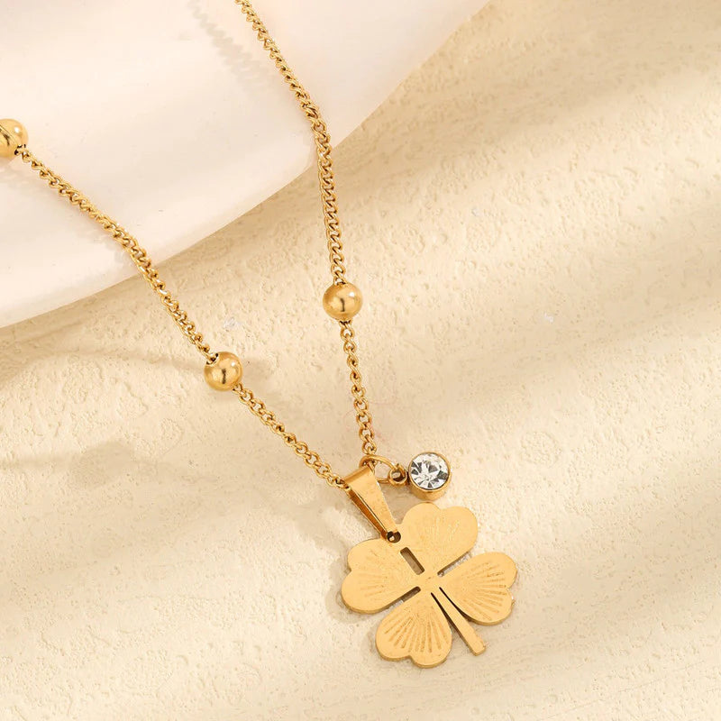 Elegant Gold Four-Leaf Clover Pendant Necklace with Crystal Charm