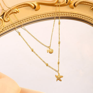Golden Starfish & Shell Charm Necklace with Pearl Accent